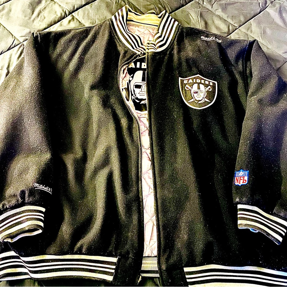 Mens Raiders Reversible NFL Sports winter jacket.  Color is black/white/silver